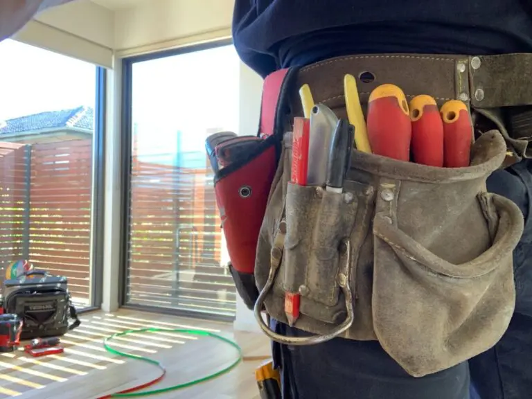 Your Electrician Bayside electrician with a tool belt on an emergency job in Melbourne