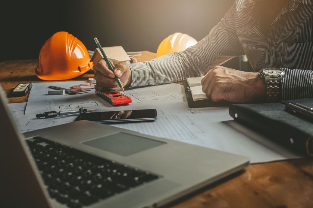 Commercial electrician reviewing electrical plans for a job in Bayside
